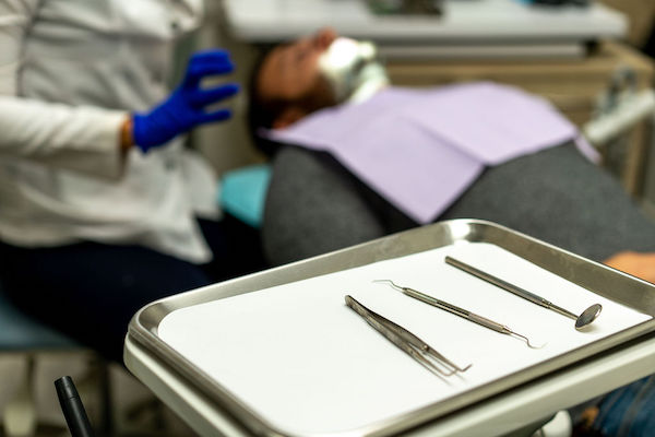 A man has orthodontics work done at BLOK Dental Family Friendly Clinic in Saskatoon Saskatchewan